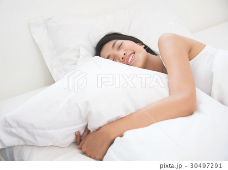 Asian beautiful woman sleeping on her bed. Asian beautiful woman sleeping on her bed. 30497291
