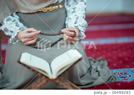 muslim woman praying in mosque muslim woman praying in mosque 30499283