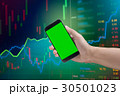Male hand holding cell phone on Statistic graph  30501023