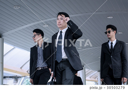 Asian business man with group of bodyguard  30503279