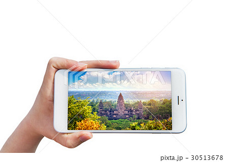 Hand holding Smartphone with image of Angkor Wat. Hand holding Smartphone with image of Angkor Wat. 30513678