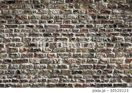 Wall of grunge black bricks 30520123