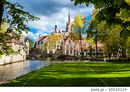 Bruges city view with houses, bridge and canal 30520124