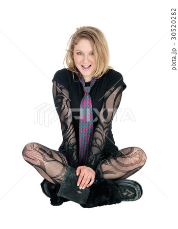 Beautiful young woman sitting on floor. Beautiful young woman sitting on floor. 30520282