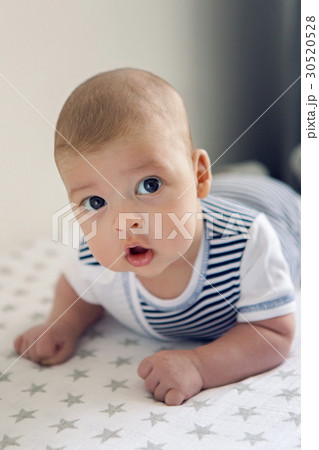 newborn lies on the stomach on a diaper newborn lies on the stomach on a diaper 30520528