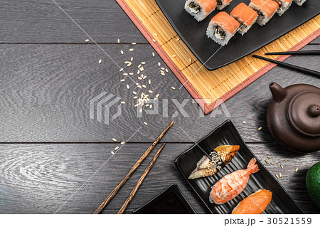 Sushi set sashimi and rolls on dark background 30521559