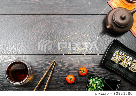 Sushi set sashimi and sushi rolls on wooden table 30521580