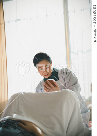 woman during pregnancy or shortly after childbirth 30523081