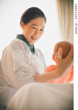woman during pregnancy or shortly after childbirth 30523084