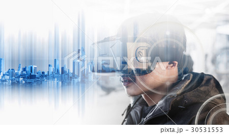 Businessman wearing virtual reality googles Businessman wearing virtual reality googles 30531553