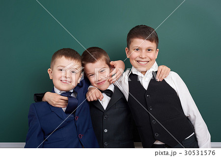 elementary school boy fooling around on blackboard elementary school boy fooling around on blackboard 30531576