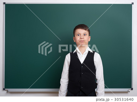 elementary school boy near blank chalkboard elementary school boy near blank chalkboard 30531640