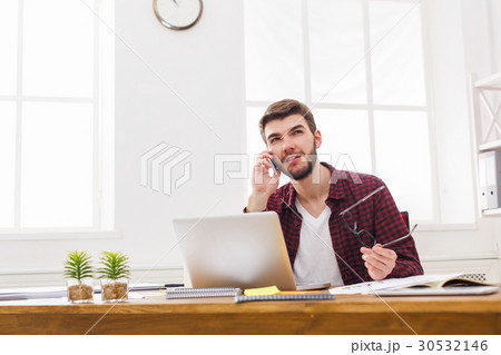 Young concentrated businessman read documents in Young concentrated businessman read documents in 30532146