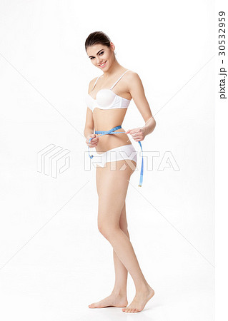 young beautiful smiling woman measuring her 30532959