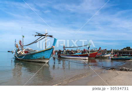 The old fishing boats moored along the shore. 30534731