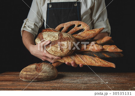 Variety of bread hold men's hands Variety of bread hold men's hands 30535131