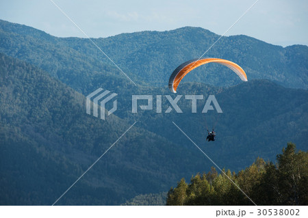 Paragliding in mountains Paragliding in mountains 30538002