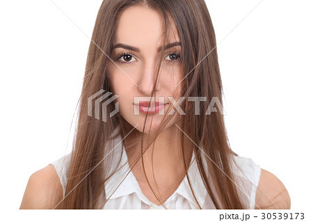 Beautiful brunette woman in a white blouse and a 30539173