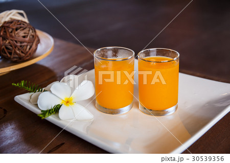 Glass of orange juice on the table Glass of orange juice on the table 30539356