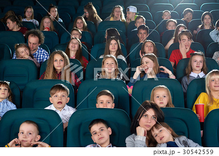 Children watching movies at the cinema Children watching movies at the cinema 30542559
