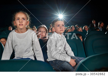 Children watching movies at the cinema Children watching movies at the cinema 30542662