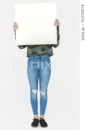 Covered Face Girl Standing and Holding Empty Placard Covered Face Girl Standing and Holding Empty Placard 30550878