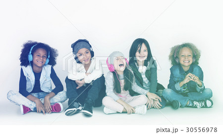 Group of Children Studio Smiling Wearing Headphones and Winter Clothes 30556978