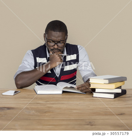 African Man Curious Thinking Reading Book Studio Portrait African Man Curious Thinking Reading Book Studio Portrait 30557179