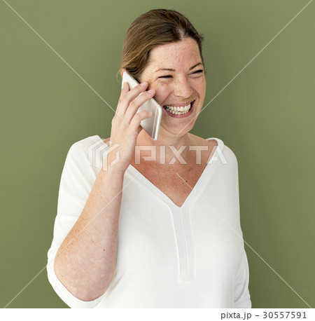 Caucasian Woman is Talking on the Phone Caucasian Woman is Talking on the Phone 30557591