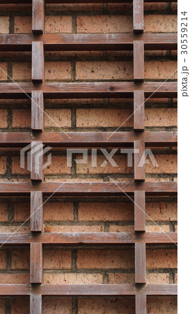 Wooden slat and brick wall. Texture background. 30559214