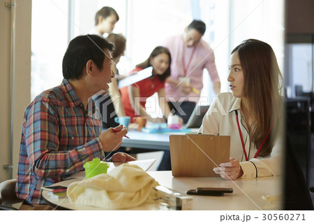 colleagues are discussing the plan. colleagues are discussing the plan. 30560271