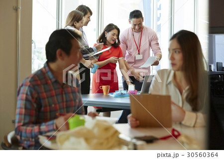 A group of people is discussing. A group of people is discussing. 30560364