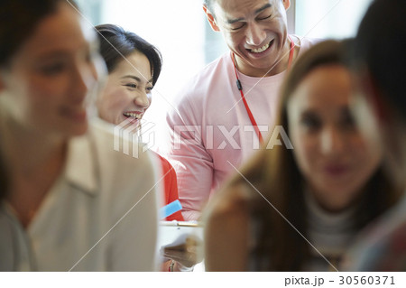 two of some colleagues are smiling 30560371