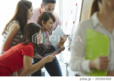 Group of people analyze business plan 30560469