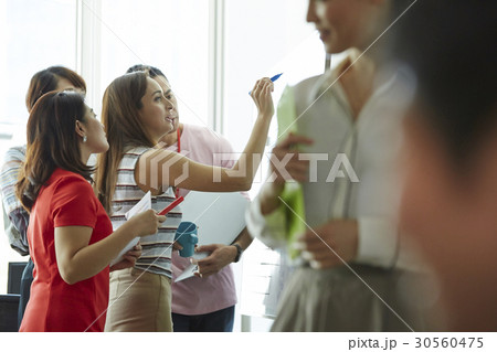 A woman is pointing something for her team A woman is pointing something for her team 30560475