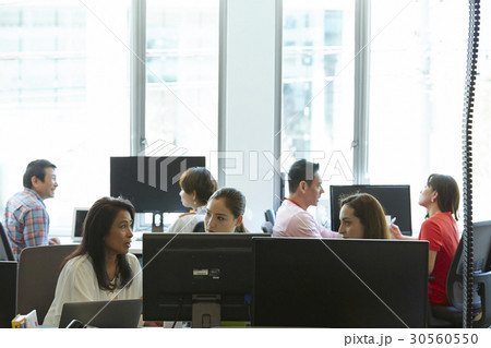 Colleagues are talking in a modern workplace 30560550