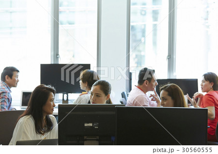 Business people discussing and working together in office. Business people discussing and working together in office. 30560555