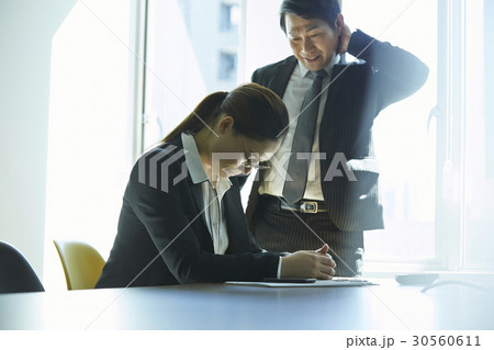 A boss rebukes a young employee. A boss rebukes a young employee. 30560611