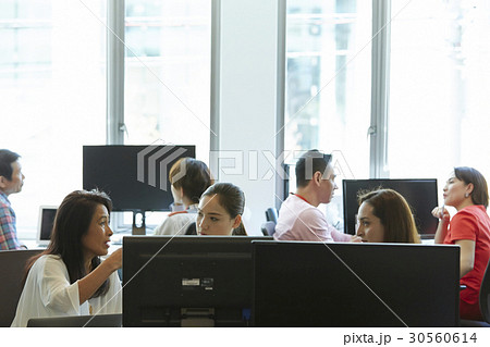 Colleagues are talking and discussing in office. Colleagues are talking and discussing in office. 30560614