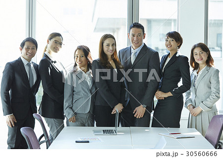 A portrait of a smiling group of asian young businessperson. A portrait of a smiling group of asian young businessperson. 30560666