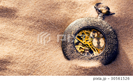 Clockwork inside mechanism in sand Clockwork inside mechanism in sand 30561526