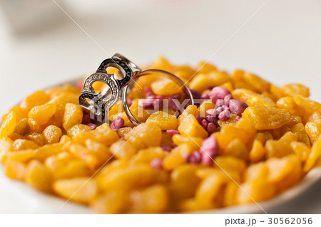 Wedding rings on a yellow pebbles. accessories Wedding rings on a yellow pebbles. accessories 30562056