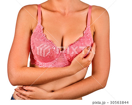 Breast self exam of women. Woman wearing bra. 30563844