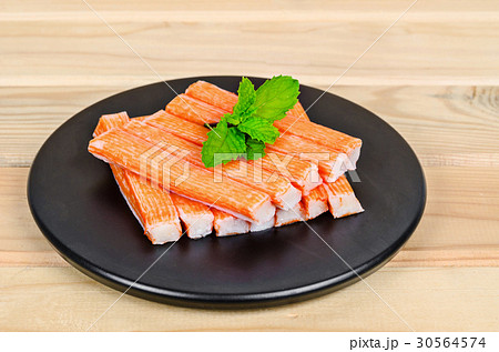 Crab Stick in black dish. 30564574