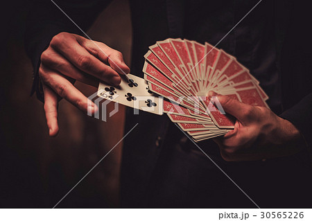 Man showing tricks with cards Man showing tricks with cards 30565226