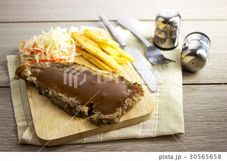 French Fries Steak, Vegetable Salad on Wooden  30565658