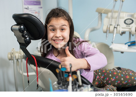 Patient girl at dental clinic office. Medicine 30565690