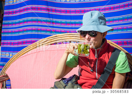 Lady having coca leaves tea Lady having coca leaves tea 30568583