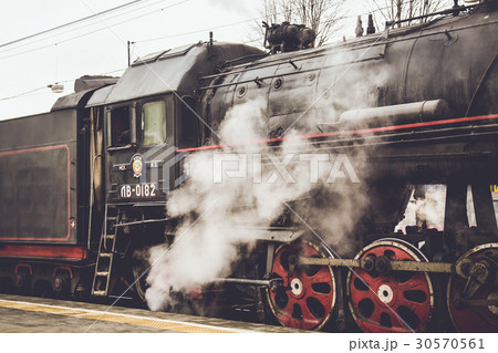 Old Soviet steam locomotive. Retro stylization Old Soviet steam locomotive. Retro stylization 30570561
