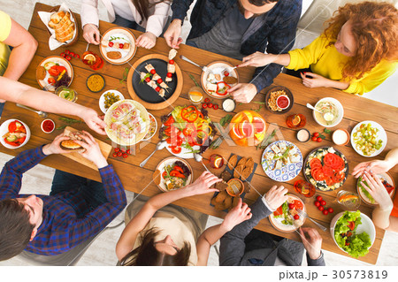 People eat healthy meals at served table dinner People eat healthy meals at served table dinner 30573819